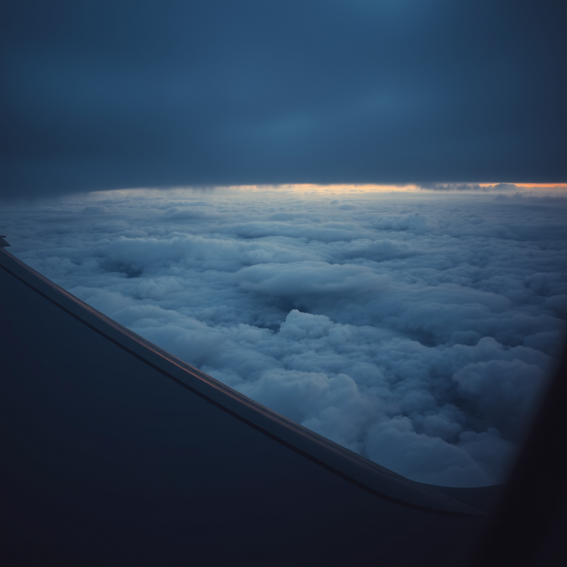 Airplane Wing View from Window Above Clouds Travel