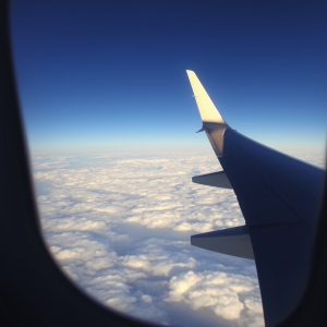 Airplane Wing View From Window Above Clouds Travel