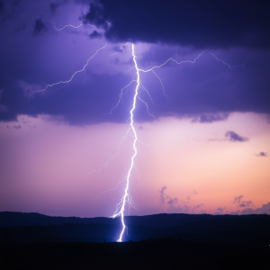 Lightning Bolt Frozen In Time Against Purple Storm Clouds