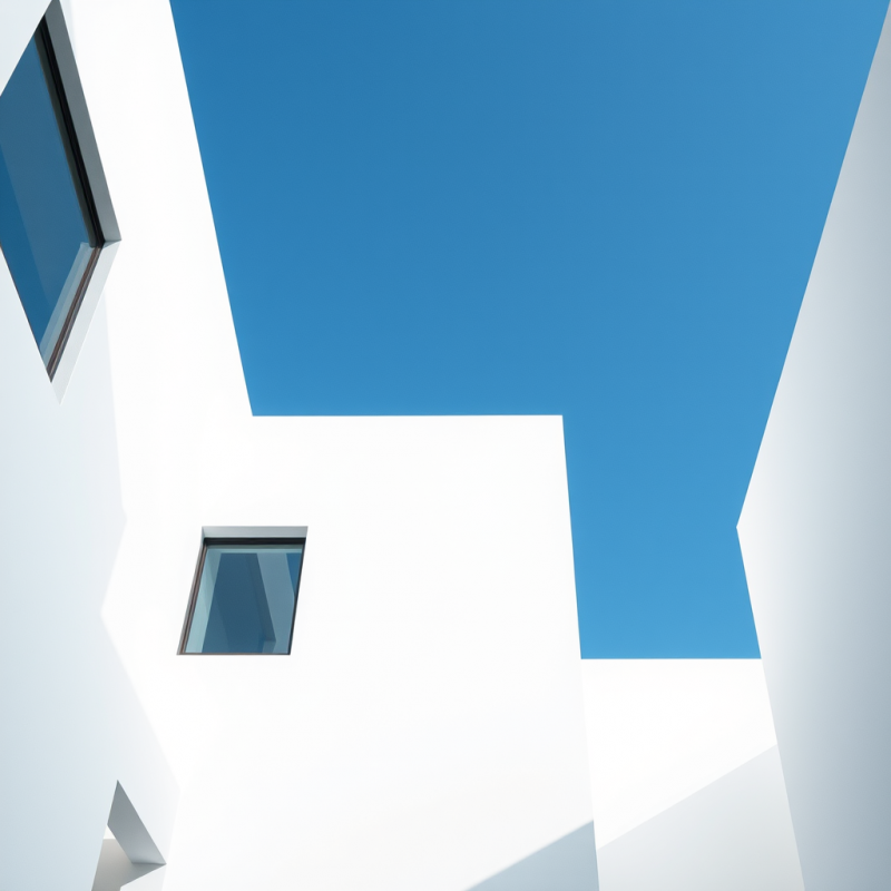 Minimal Architecture White Building Against Blue Sky Clean