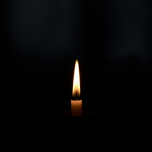 Single Candle Flame On Dark Background Peaceful