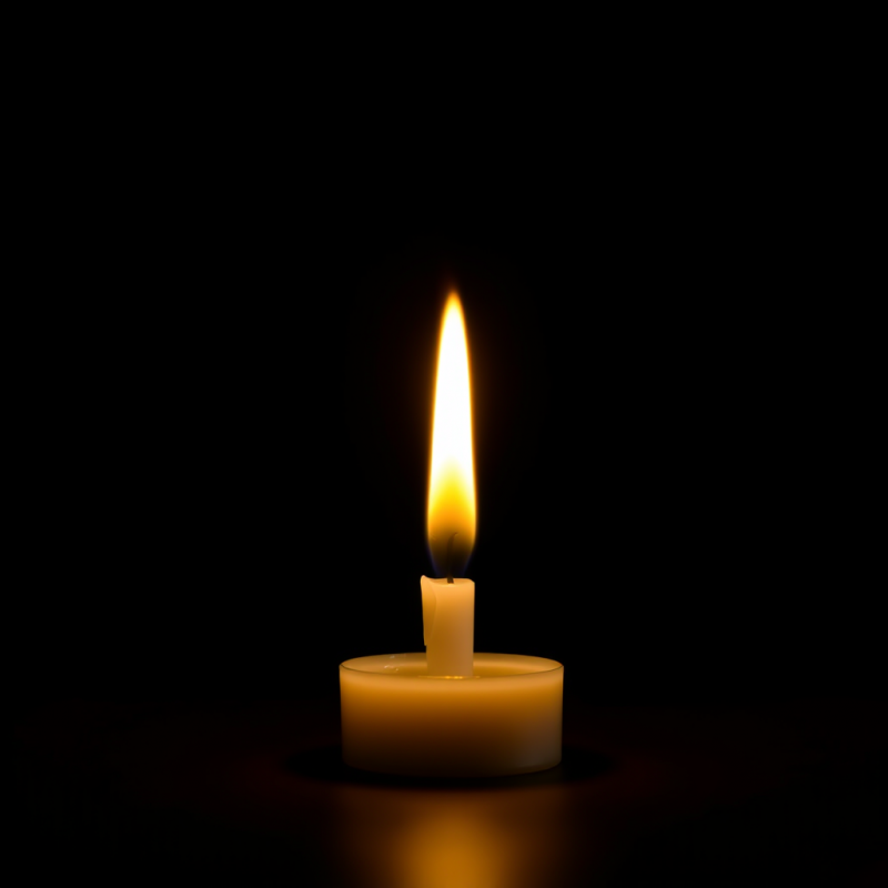 Single Candle Flame on Dark Background Peaceful
