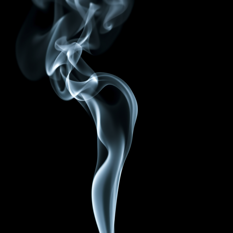 Smoke Tendrils Frozen in Time Against Pure Black Background
