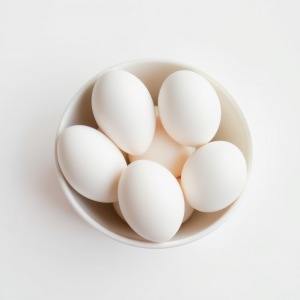 White Eggs In White Bowl On White Surface Pure