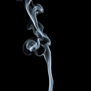 Smoke Tendrils Frozen In Time Against Pure Black Background